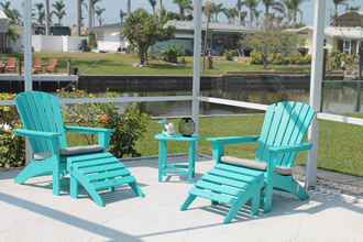 Poolarea with relaxing adiron deck chairs